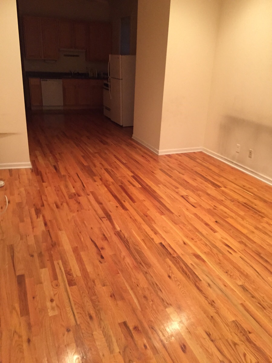 a living room with a hard wood floor
