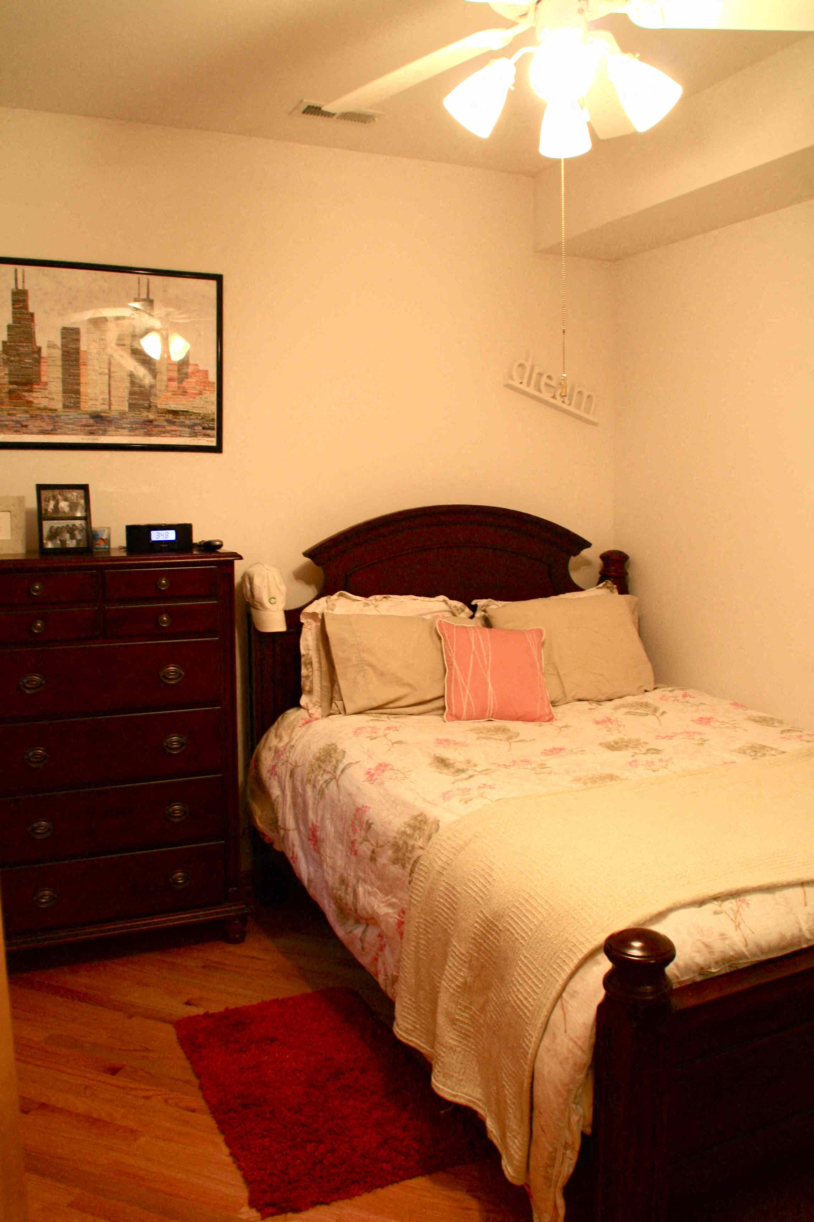 a bedroom with a bed and a dresser
