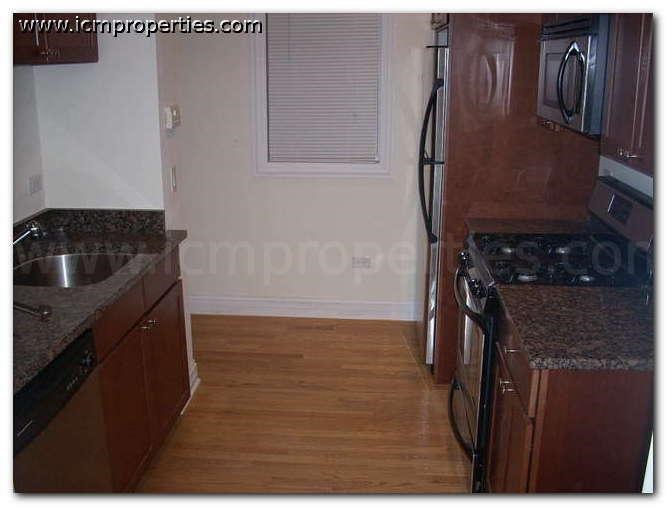 a kitchen with a stove and a sink