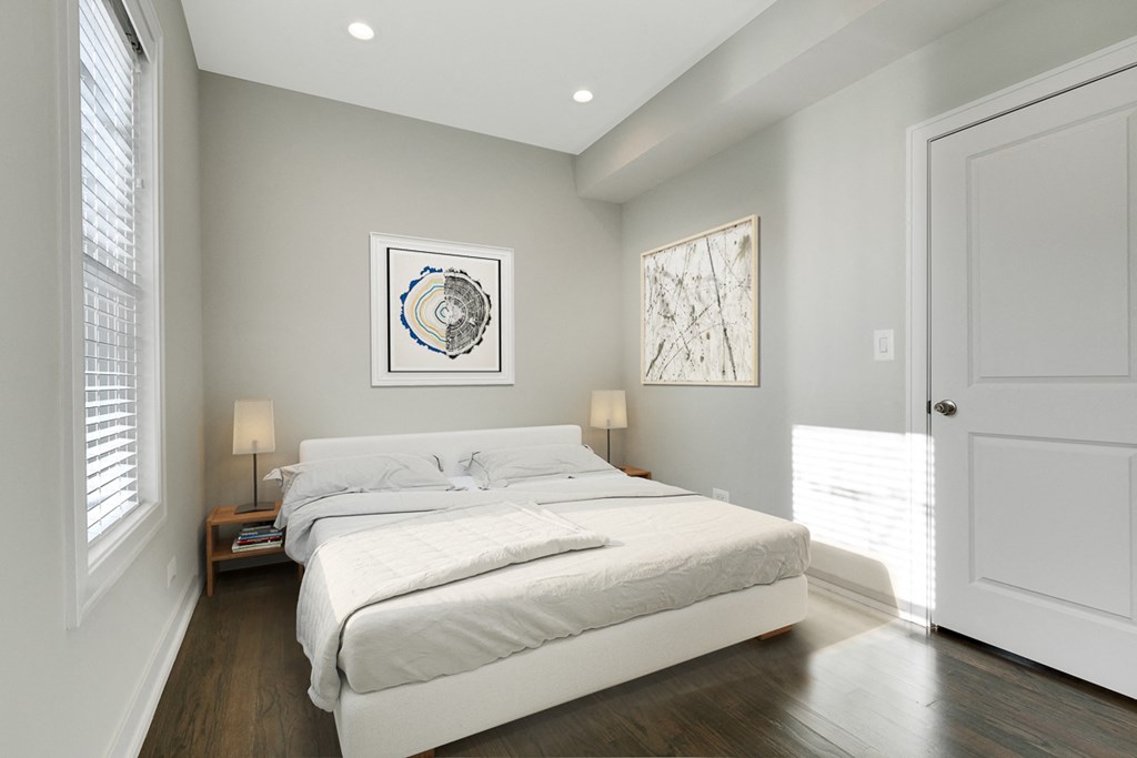 a bedroom with a bed and a door to a bathroom