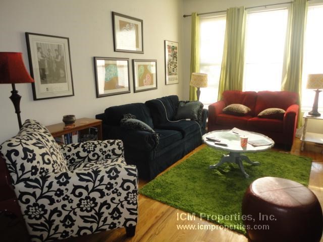a living room with a couch and a table