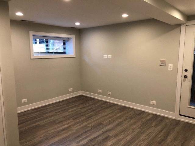 a empty room with a window and a door