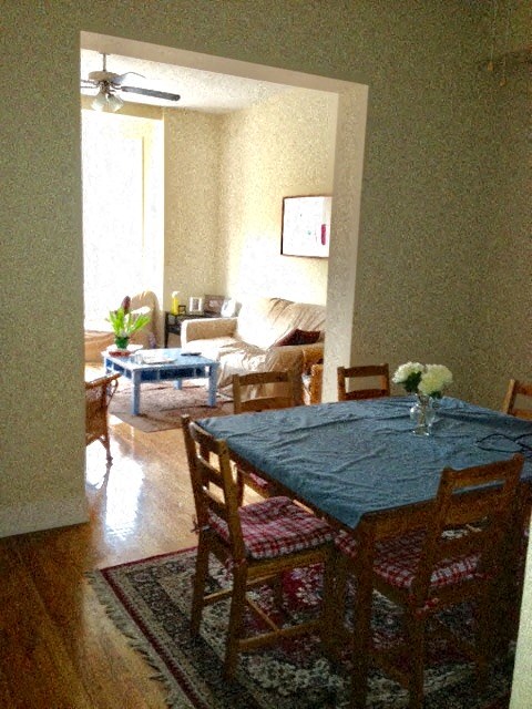 a dining room table and chairs in a living room