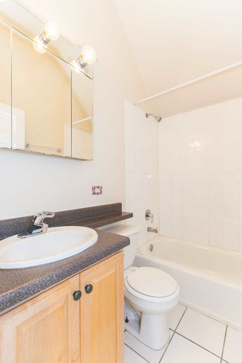 a bathroom with a sink toilet and a bath tub