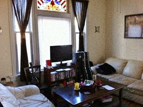 a living room with two couches and a television