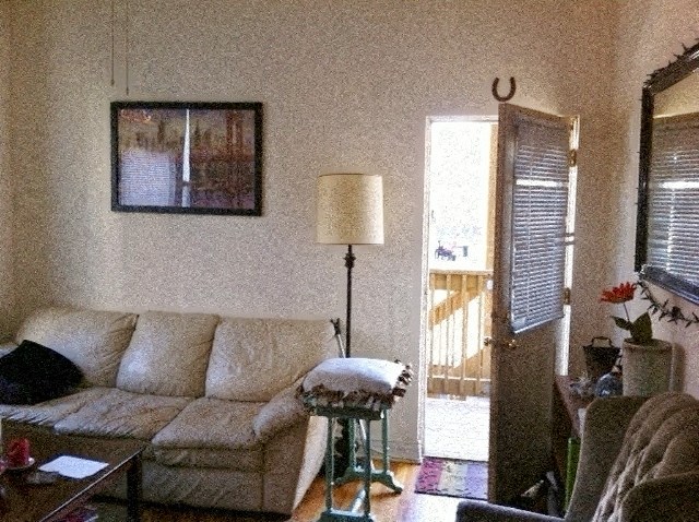 a living room with a couch and a table