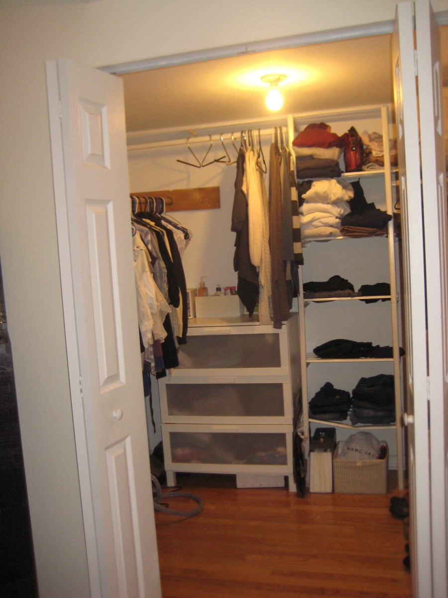 a closet with shelves and a light in it