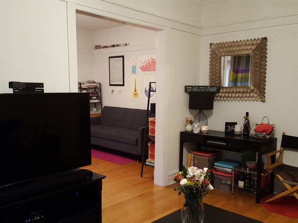 a living room with a couch and a tv