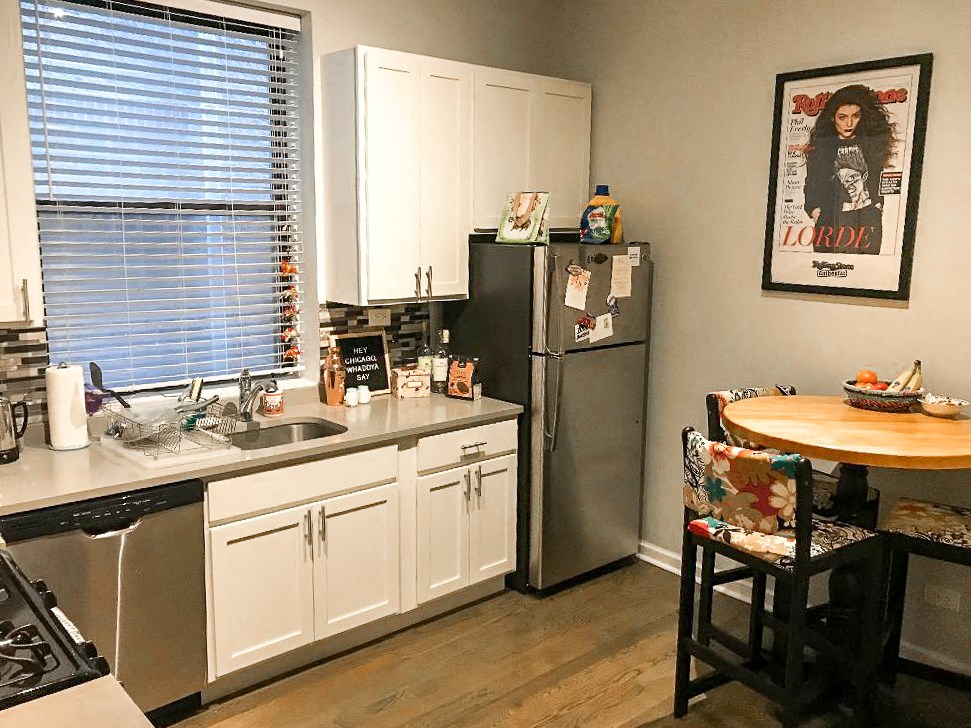 a kitchen with a sink and a refrigerator