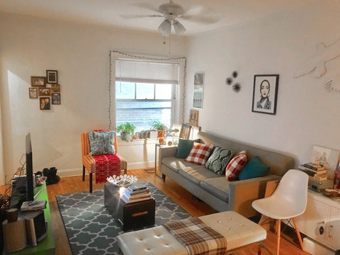 a living room with a couch and a table