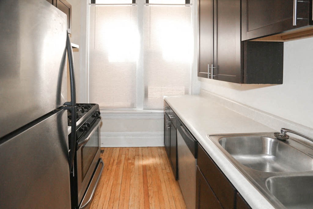 a kitchen with stainless steel appliances and a sink