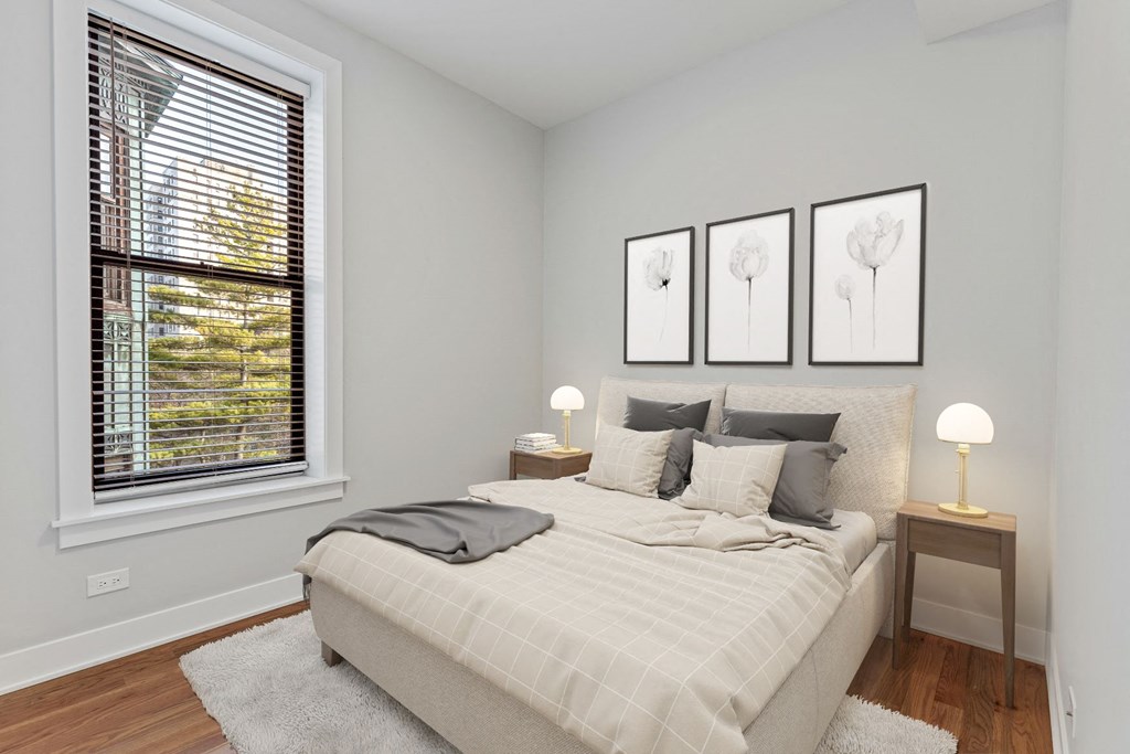 a bedroom with a bed and a window