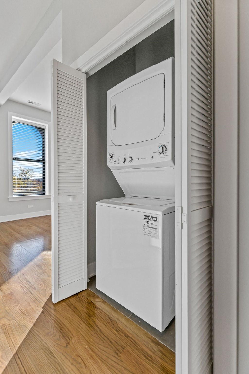 the laundry room has a washer and dryer and a window
