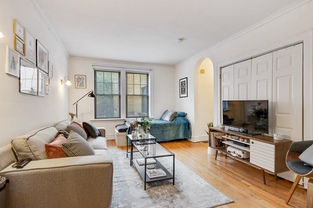 a living room with a couch and a tv