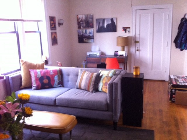a living room with a couch and a table