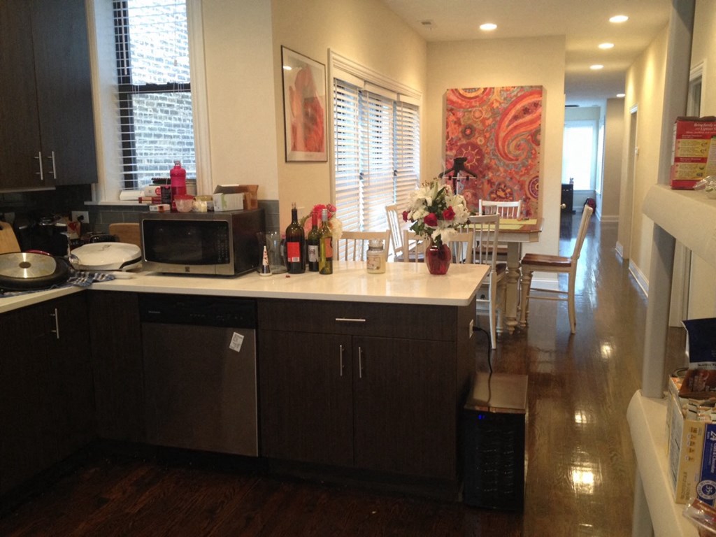 a view of a kitchen with a counter and a living room