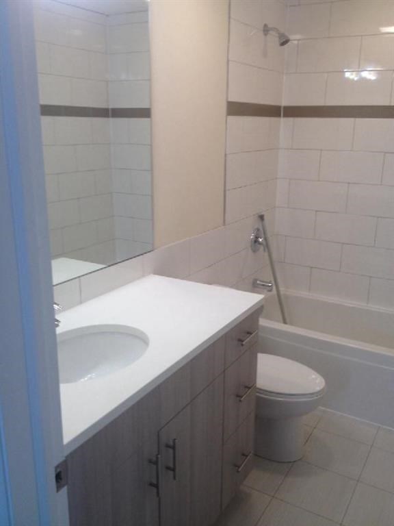 a bathroom with a sink toilet and a shower