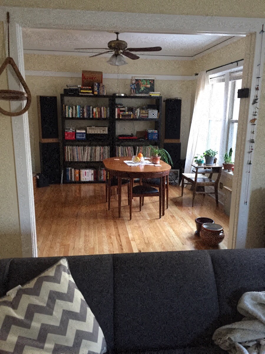 a living room with a table and a couch