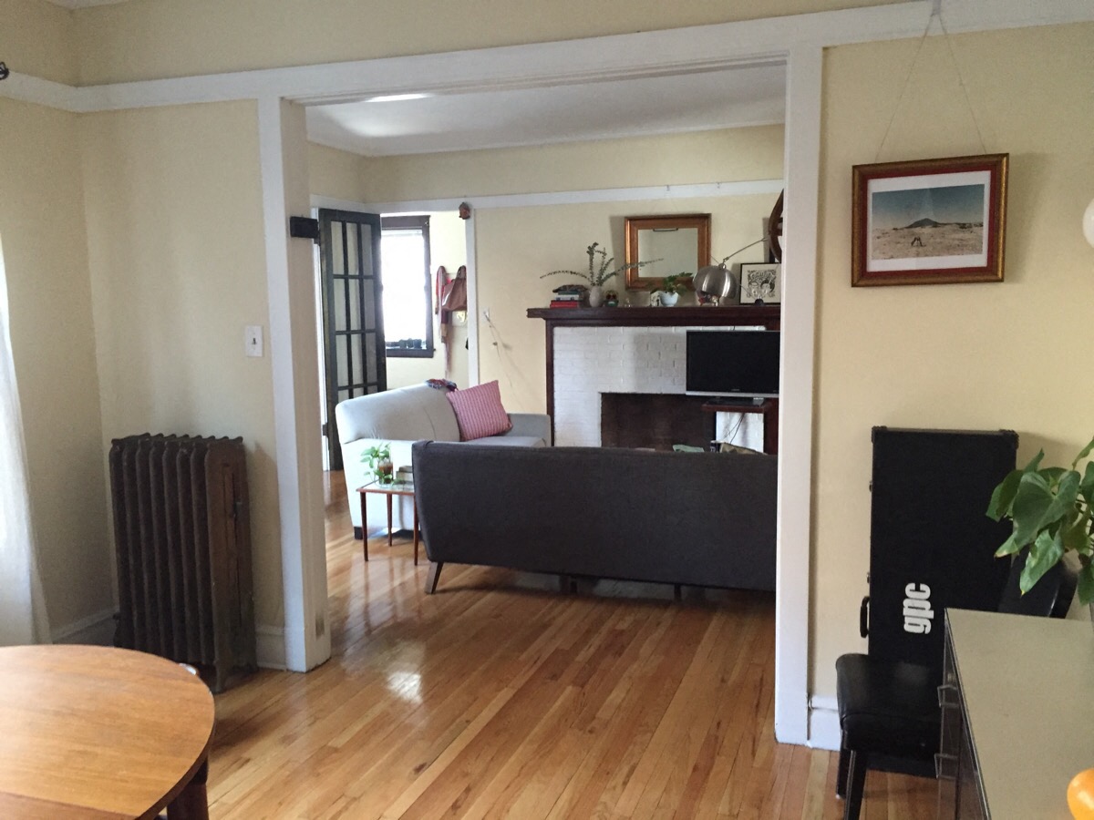 a living room with a couch and a fireplace
