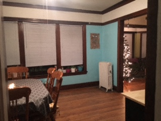 a dining room with a table and chairs