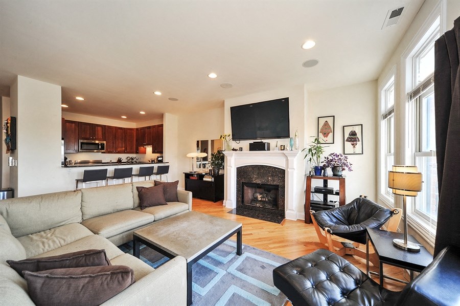 a living room with a couch and a fireplace