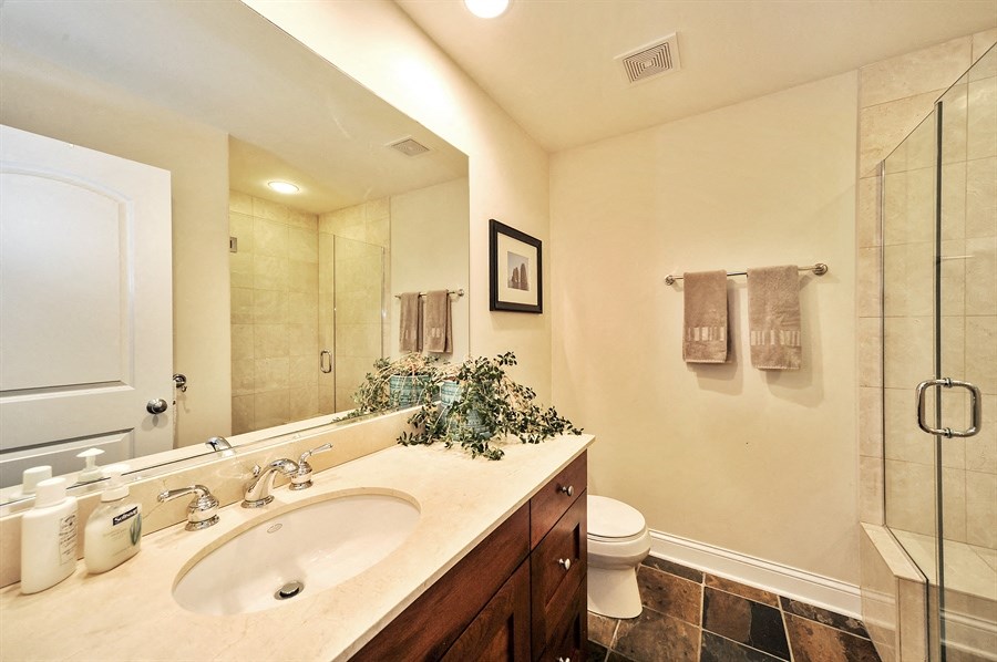 a bathroom with a sink and a toilet and a shower