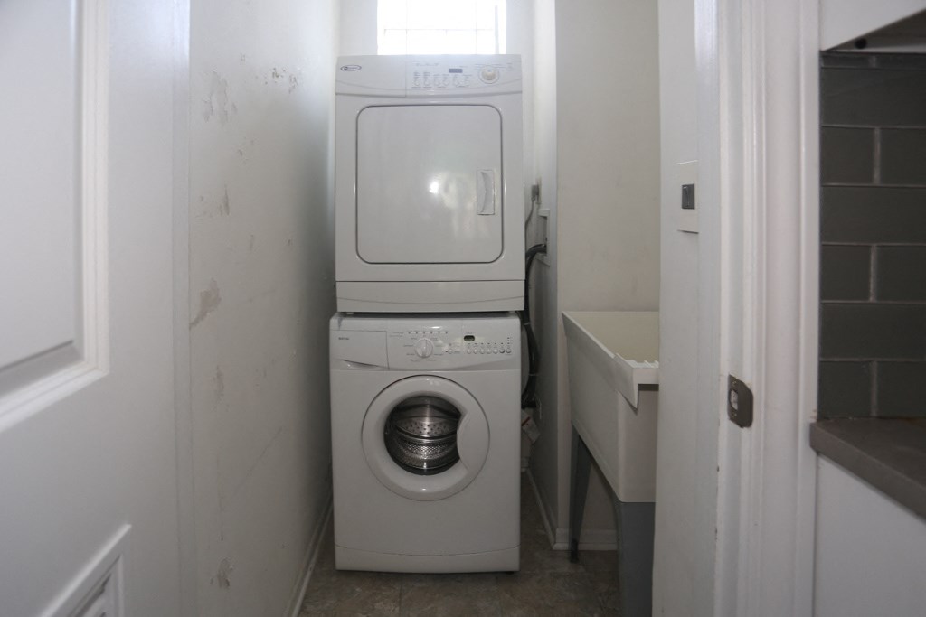 the laundry room has a washer and dryer in it
