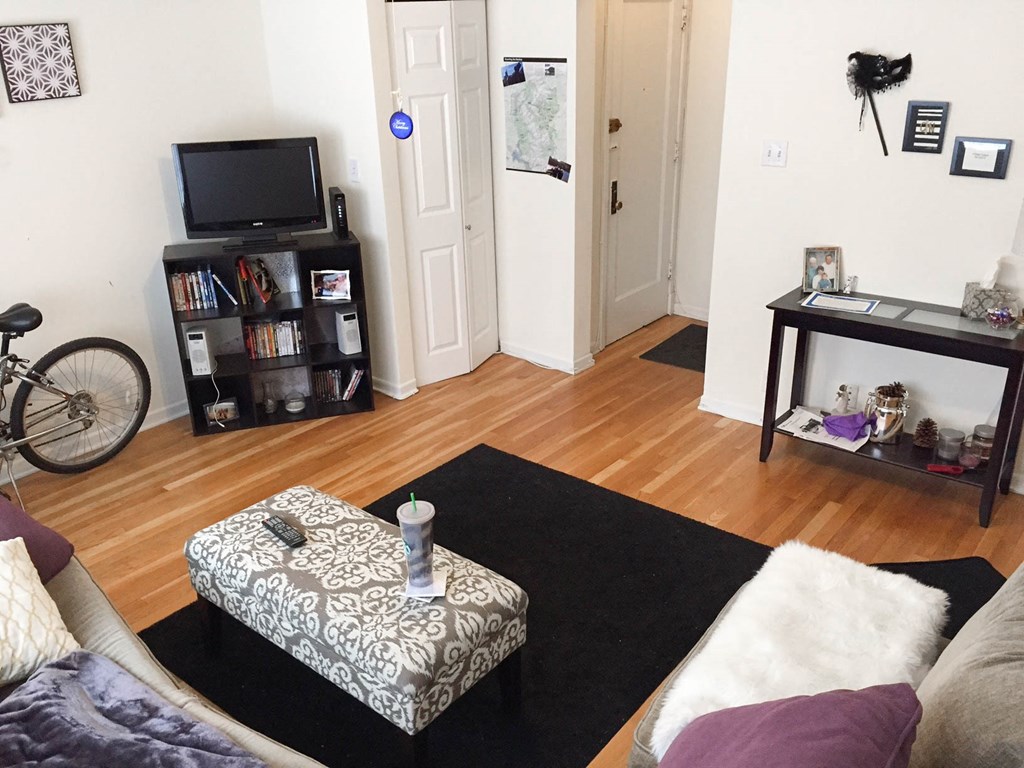 a living room with a couch and a tv