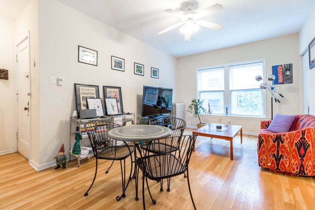 a dining room with a table and chairs and a tv