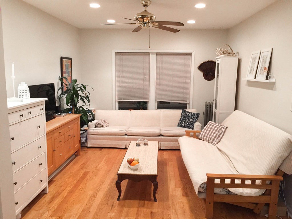 a living room with a couch and a table