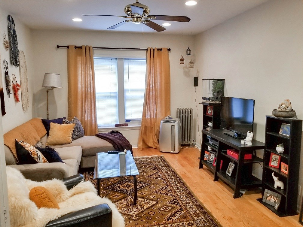 a living room with a couch and a tv