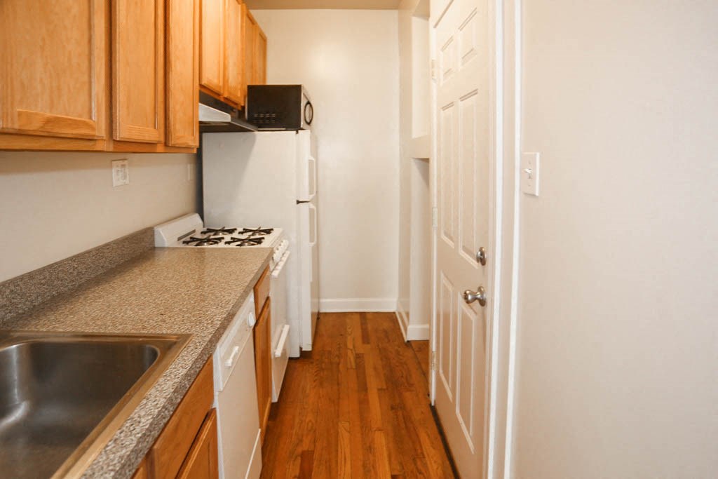 a kitchen with a counter top and a sink