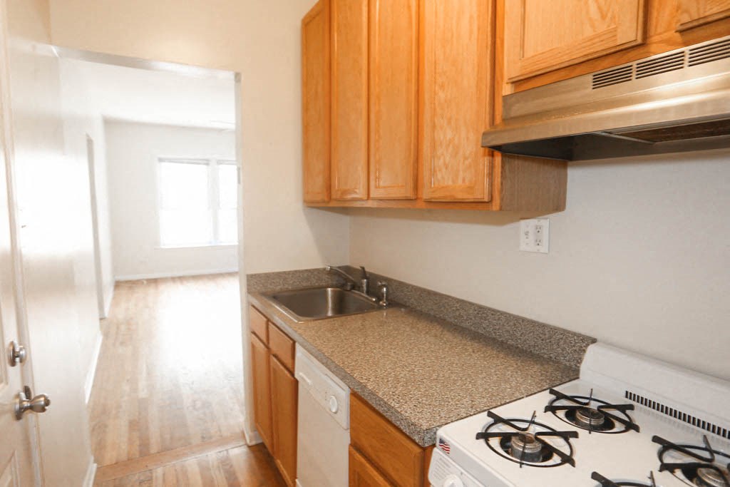 a kitchen with a stove and a sink