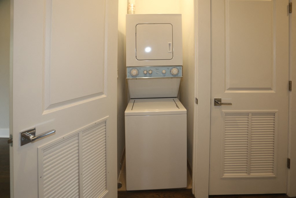 a small laundry room with a washer and dryer