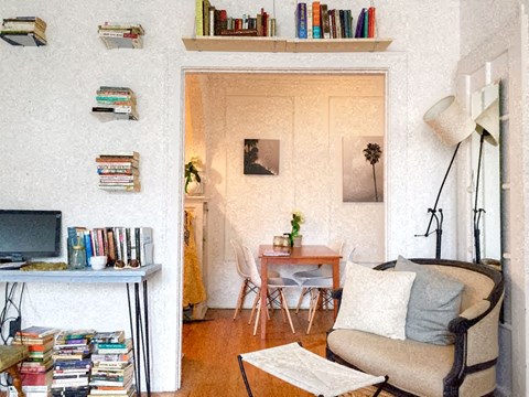 a small living room with a couch and a table