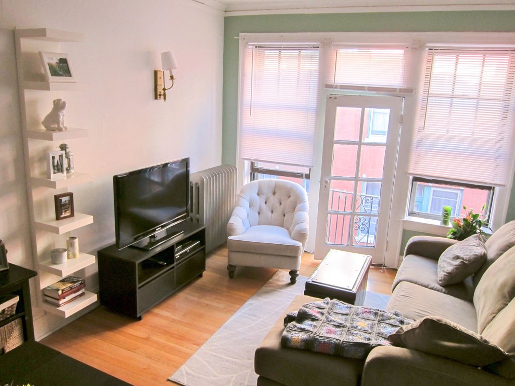 a living room with a couch and a television