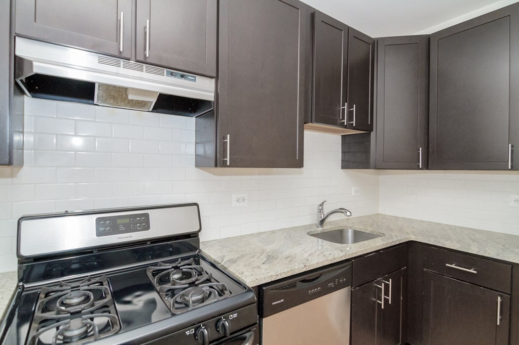 a kitchen with a stove and a sink