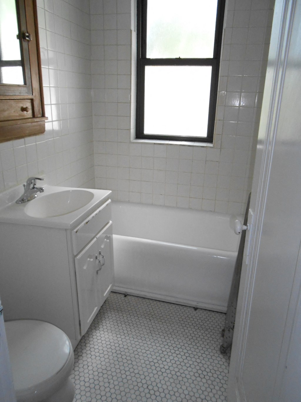 a bathroom with a sink toilet and a bath tub
