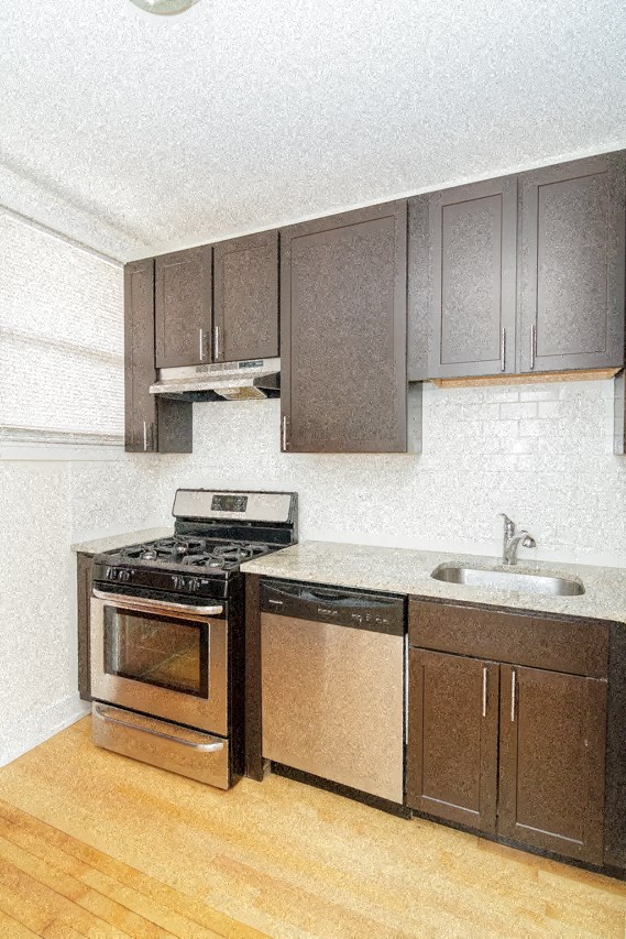 a kitchen with a stove and a sink