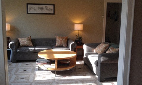 a living room with two couches and a coffee table