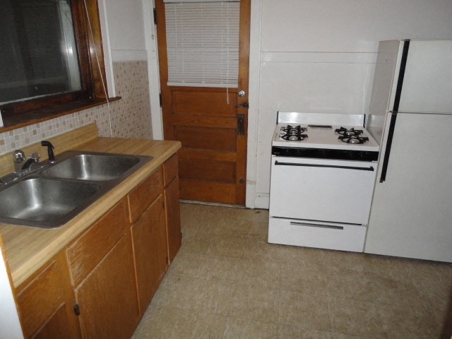 a kitchen with a stove and a sink