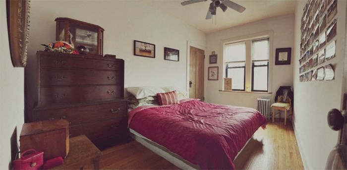 a bedroom with a bed and a dresser