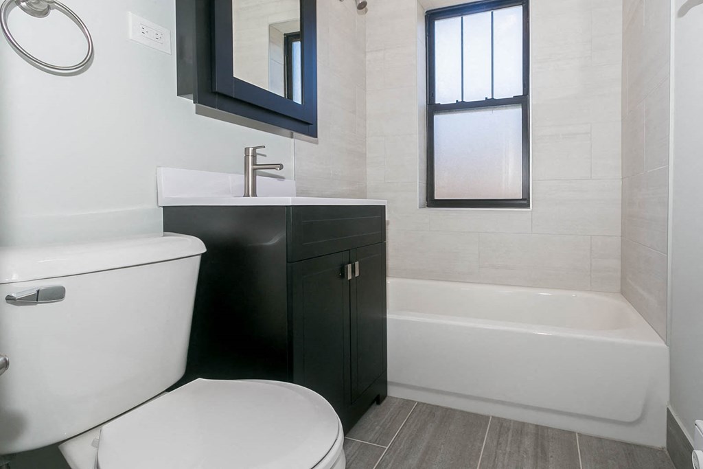 a bathroom with a toilet and a sink