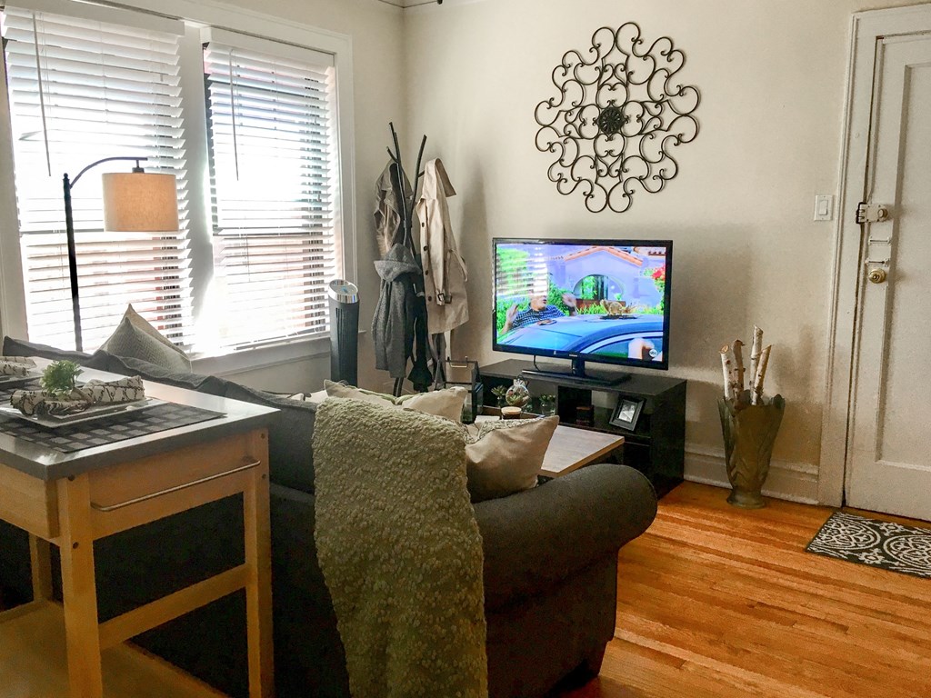 a living room with a couch and a tv