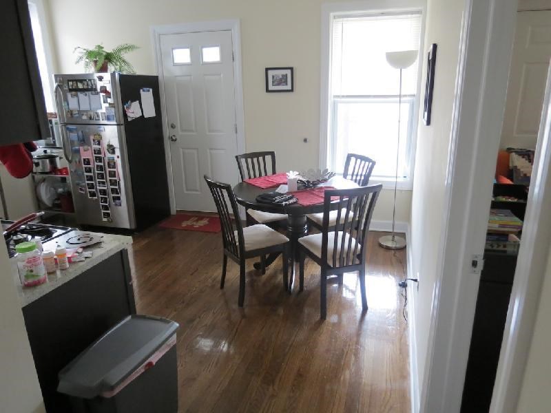 a dining room with a table and chairs