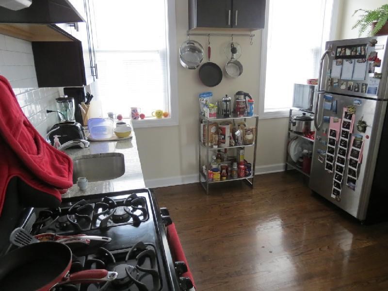 a kitchen with a stove and a refrigerator