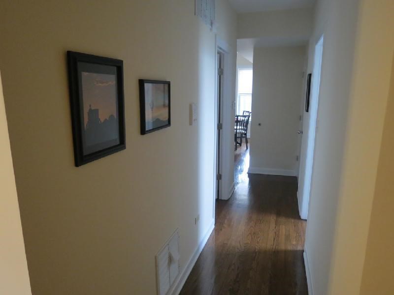 a living room with two pictures on the wall