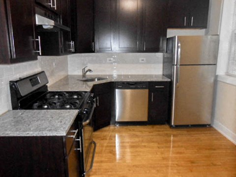 a kitchen with a stove and a refrigerator