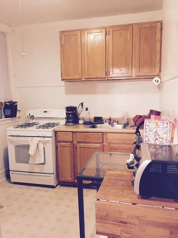 a kitchen with a stove and a table