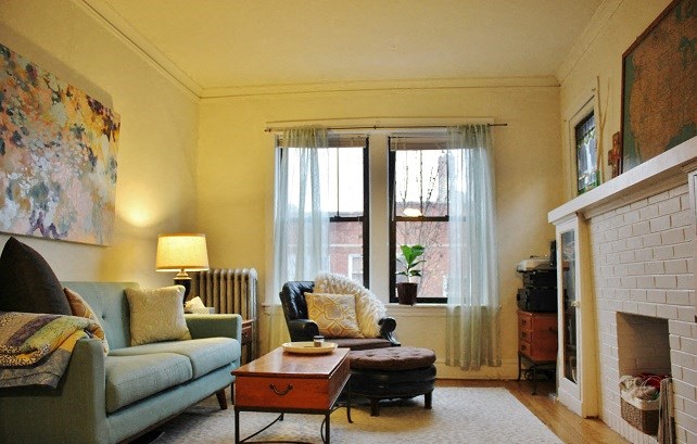 a living room with a couch and a fireplace